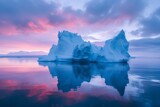 Nature's beauty reflected in the icy depths of a glacial lake as the melting iceberg meets the fiery hues of a sunset sky
