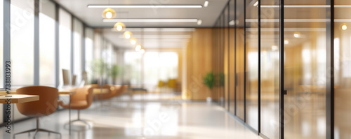 Warmly lit office lounge with blurred modern furnishings.