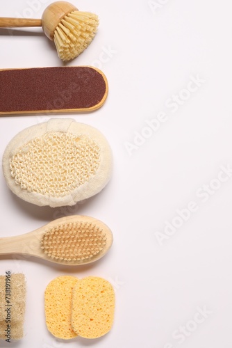 Bath accessories. Flat lay composition with personal care tools on white background, space for text