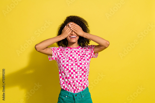 Photo of positive nice lady hands palms cover eyes do not look empty space isolated on yellow color background