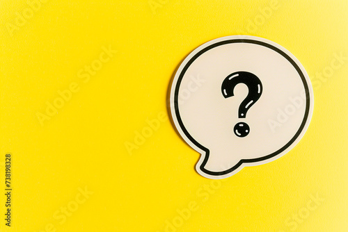 Question Mark on Yellow Background. Ask Symbol. Speech Bubble. photo