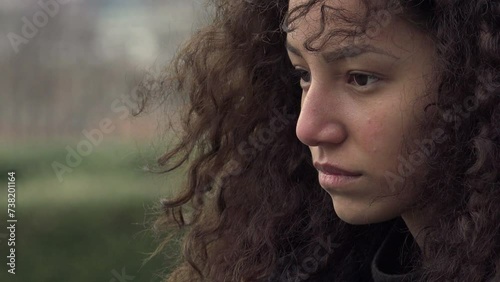 lost in her thoughts: beautiful young sad and lonely woman