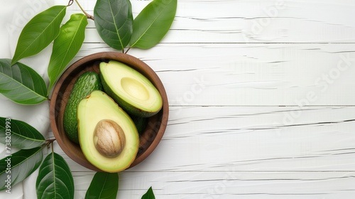 avocado in Bowl and green leaves on white wooden background. generative ai
