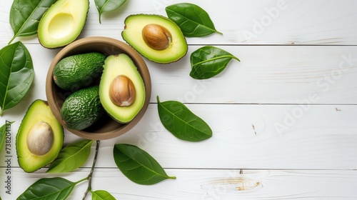 avocado in Bowl and green leaves on white wooden background. generative ai