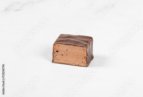 Fototapeta Naklejka Na Ścianę i Meble -  Chocolate souffle in chocolate. In the section. White background. Close-up