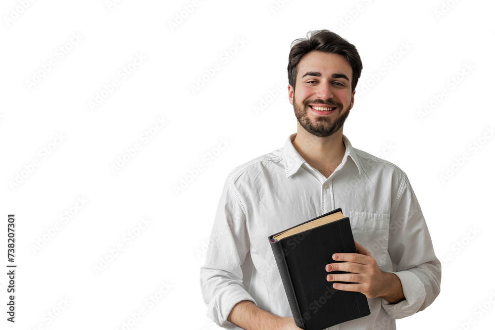 Man in White Shirt Holding Book. A man dressed in a white shirt is photographed while holding a book in his hands.