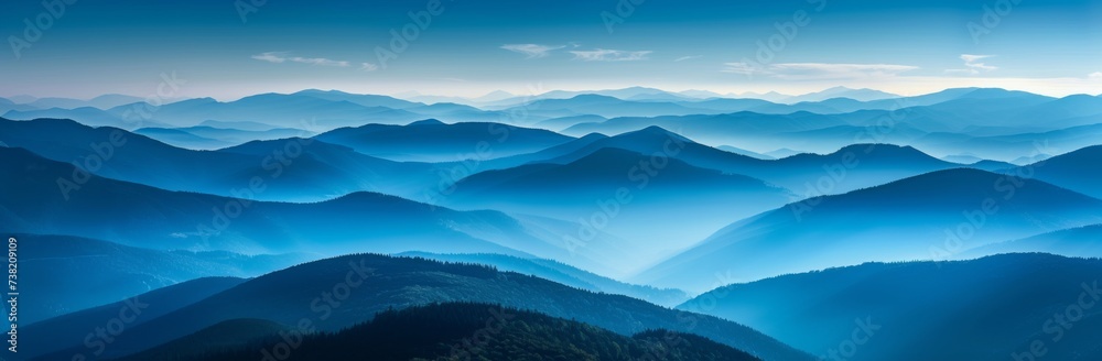 Hills and mountains in fog. Horizontal landscape photography. Panoramic aerial view. Image for banner, blog, advertisement.