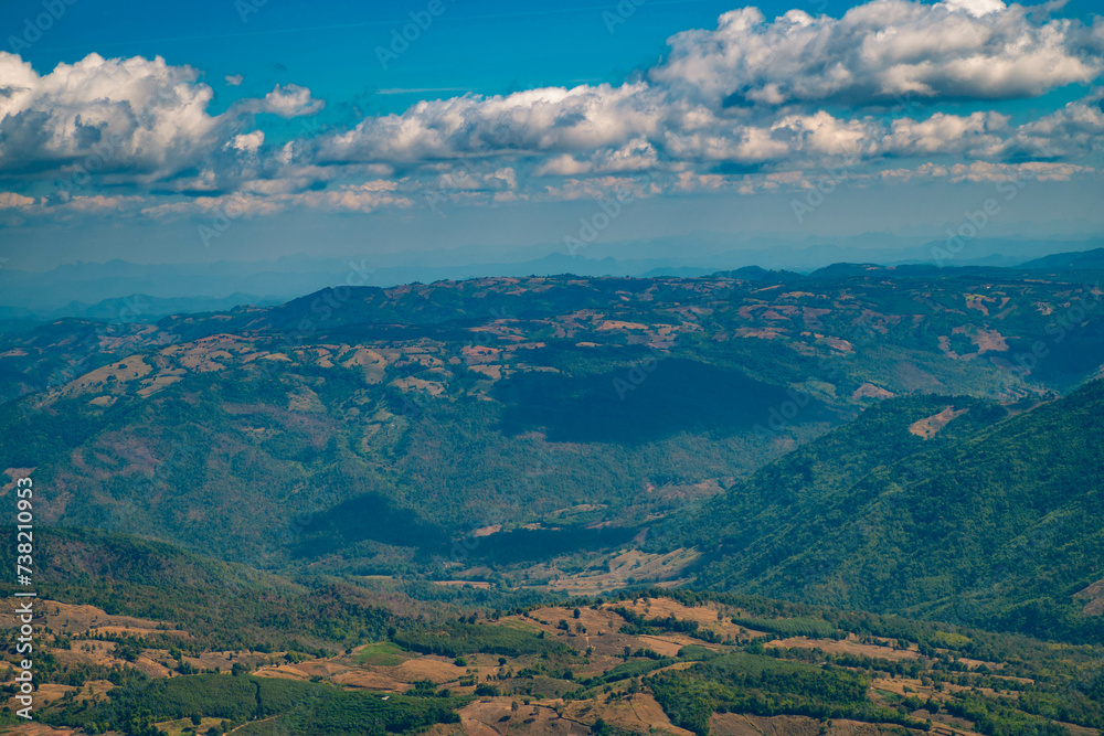The stunning view in Forest Park from a tourist's standpoint as they go down a hill with background of blue sky, Rainforest, Thailand. Bird's eye view. Aerial view. The stunning view in Forest Park from a tourist's standpoint as they go down a hill with background of blue sky, Rainforest, Thailand. Bird's eye view. Aerial view.