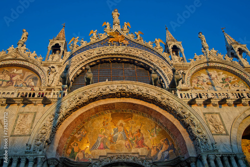 VENICE, ITALY, February 2, 2024 : Facade of San Marco basilica at the golden hour