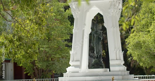 Green buddha statueTha Khanun Temple is a popular temple in Kanchanaburi Province. photo