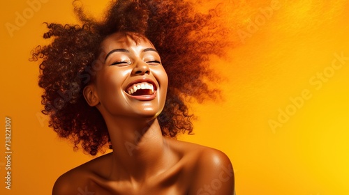 Portrayal of a dynamic black woman beaming with happiness on a coloured background