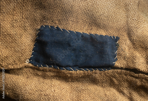 Blue-darned bag. Rough canvas, burlap, sackcloth close up