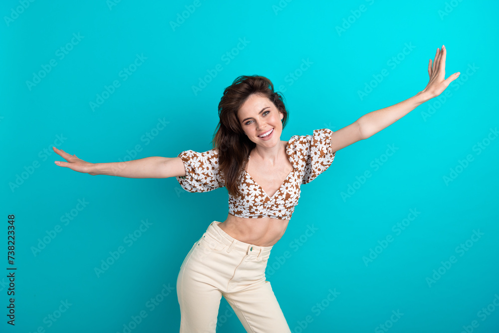 Naklejka premium Photo of young carefree positive woman fly with wings arms chill time free time traveler isolated over aquamarine color background