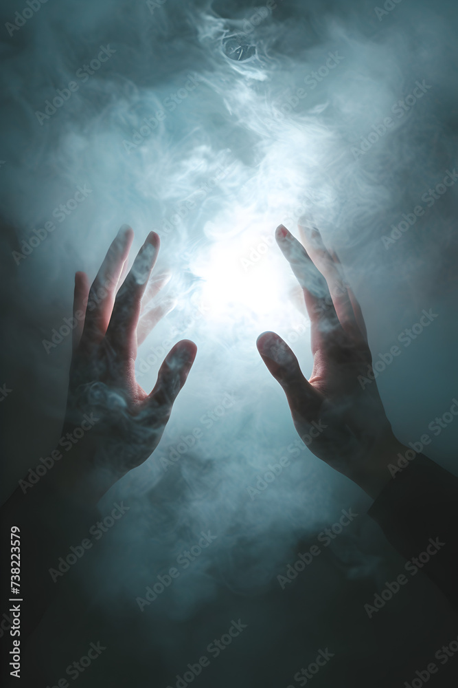 Conceptual photo of hands breaking through a barrier of fog, visualizing the process of overcoming mental obstacles


