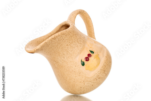 One ceramic milk jug, macro, isolated on white background.