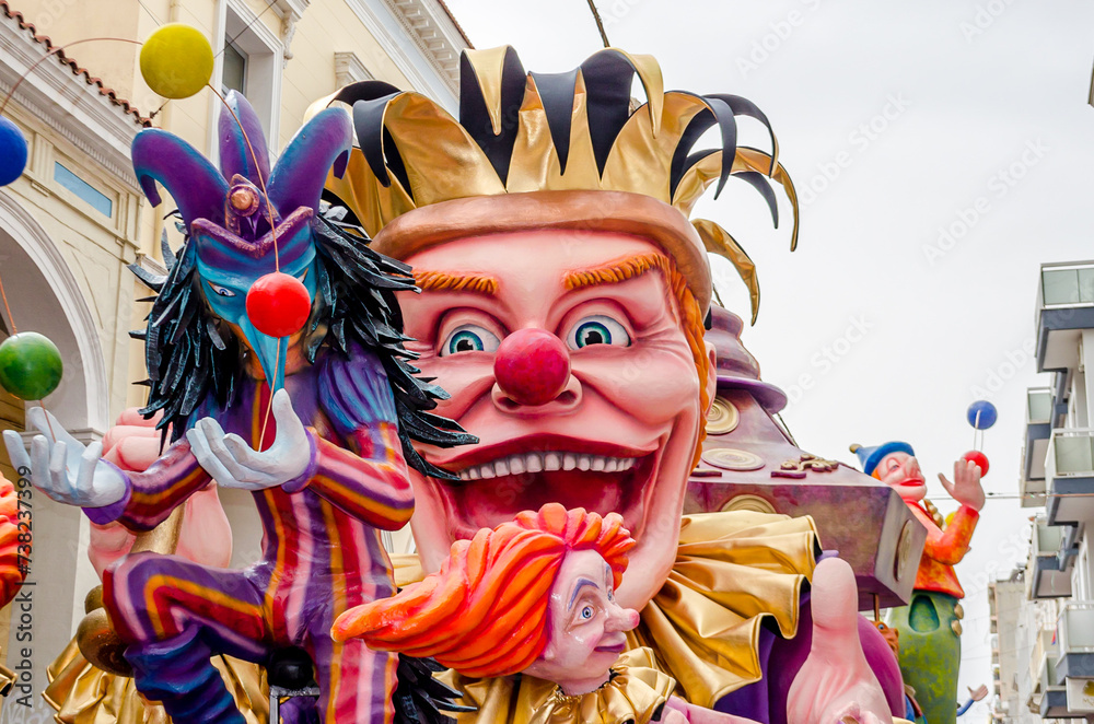 Naklejka premium Giant King of Carnival Float in Front of the Procession in Patra City, Greece. Annual Traditional Street Parade Full of Moving Colorful Sculptures, Masks and Costumes