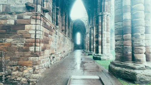 Foggy winters scene of the famous landmark Whitby Abby now derelict and formally a Benedictine abbey and is situated overlooking the sea on the East coast of England photo