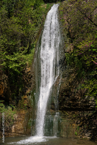 Fototapeta Naklejka Na Ścianę i Meble -  Wild forest waterfall in daylight