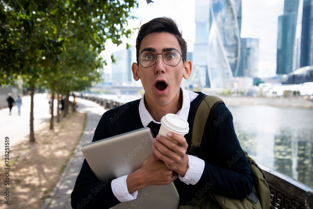 Good grades. A young attractive student is happy about going to college. A guy is walking in the city. Good grades. A young attractive student is happy about going to college. A guy is walking in the city.