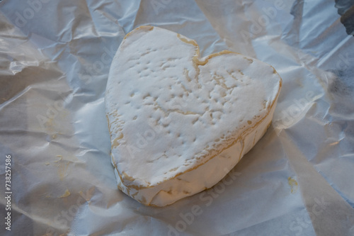 Cheese collection, French cheese from Normandy region, heart-shaped neufchatel close up photo