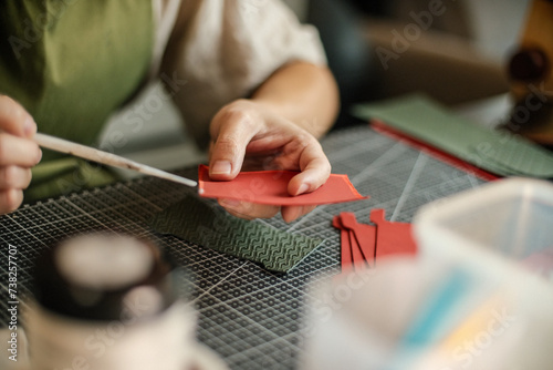 Leather craftsman working with leather glue