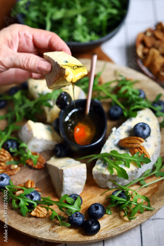 Blue cheese with honey  arugula and blueberries. Healthy salad with arugula and dorblu.