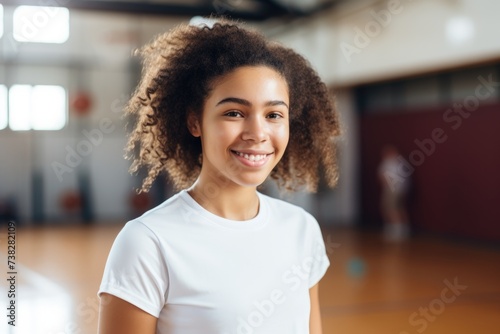 Smiling portrait of a young woman in the basketball gym © Vorda Berge