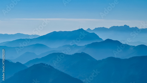 Panoramic view of magical mountain peaks of Karawanks and Julian Alps seen from Goldeck, Latschur group, Gailtal Alps, Carinthia, Austria, EU. Mystical atmosphere in Austrian Alps on sunny summer day. © Chris