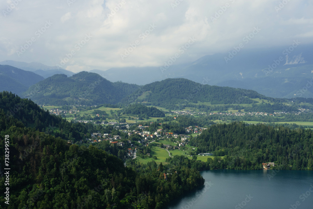 top view of gorgeous clear water blue lake and mountains around in slovenia