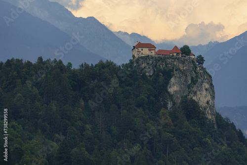 castle close up look on top of hill surrounded by green nature  photo