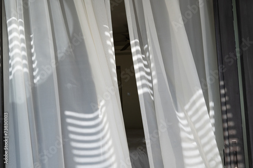 Close up of a curtain with sharp light in the hotel room. Concept of interntional vacation, travel and leasure. photo