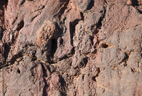 Red volcanic rock texture close up