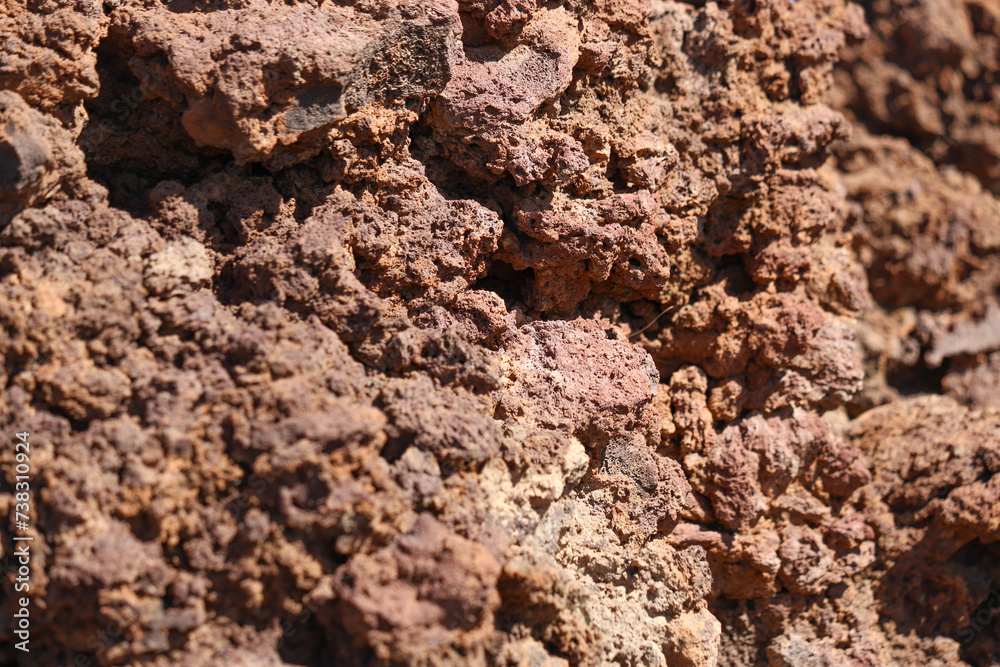 Red volcanic rock texture close up