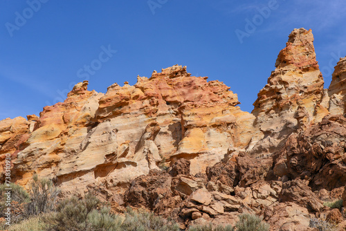 Piedras Amarillas rock formation in El Teide National Park on Tenerife. Orange volcanic cliffs close up.