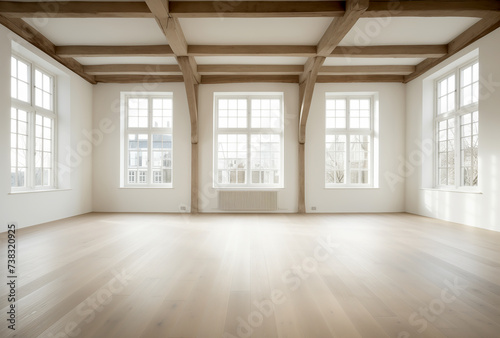 An empty room with parquet and wooden ceiling