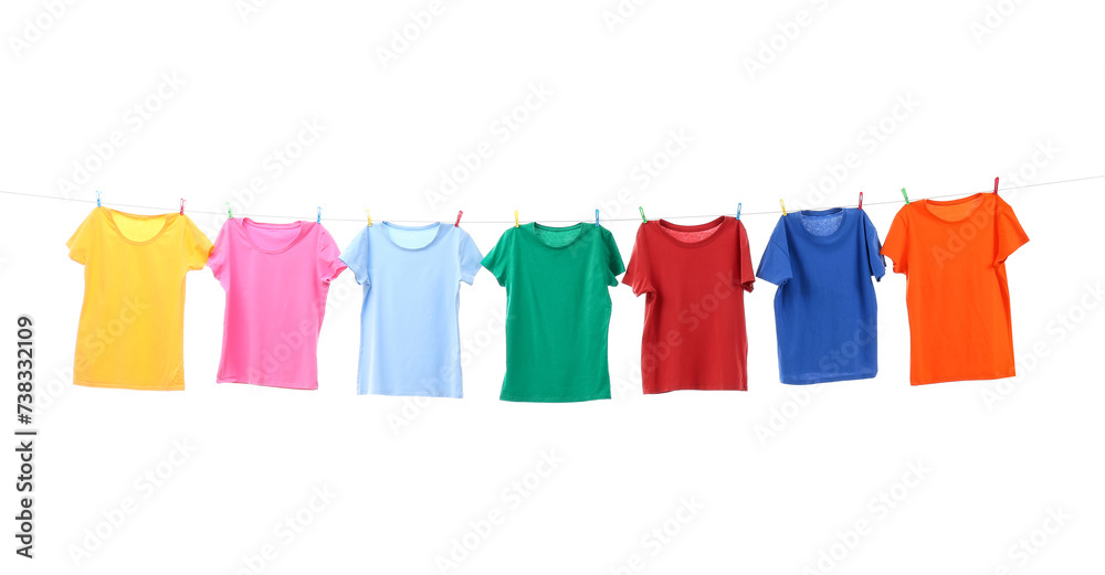 Colorful t-shirts drying on washing line isolated on white