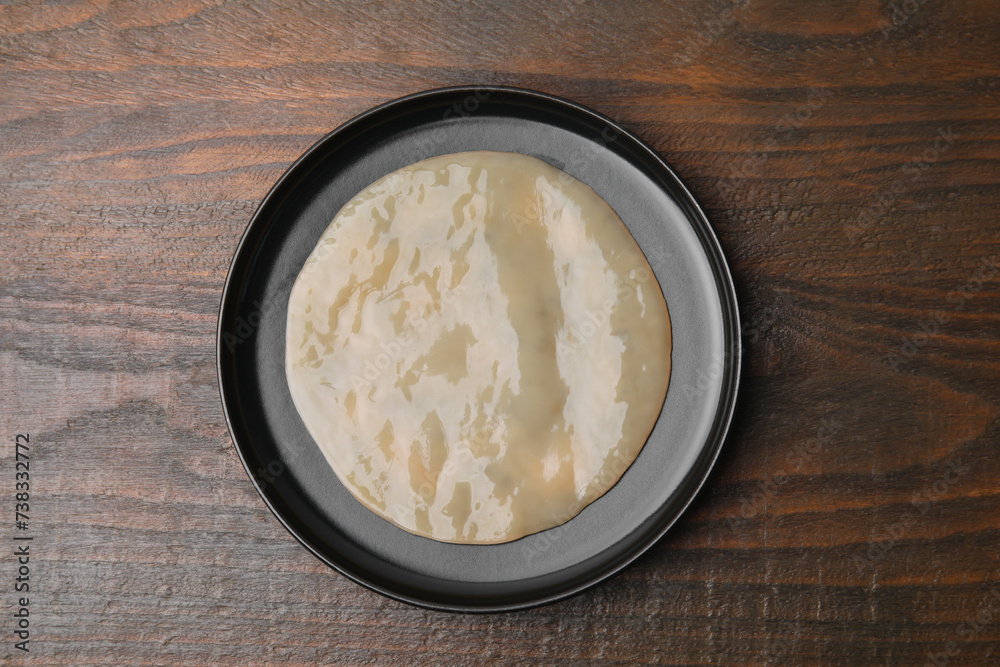 Making kombucha. Scoby fungus on wooden table, top view Making kombucha. Scoby fungus on wooden table, top view