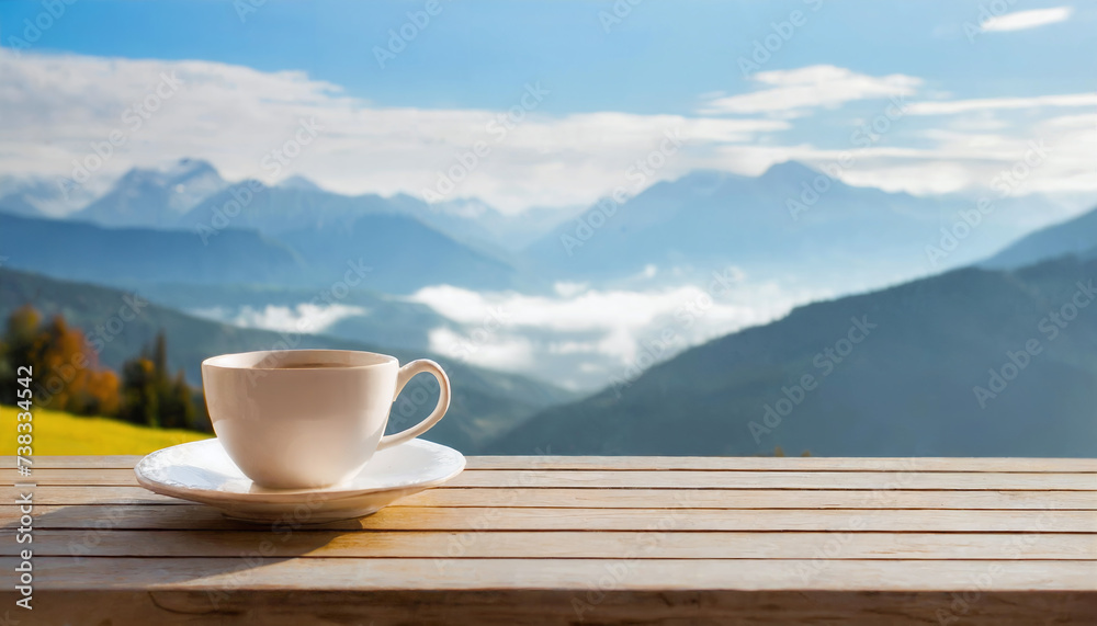Cup of tasty coffee on wooden table with mountain landscape in background Cup of tasty coffee on wooden table with mountain landscape in background