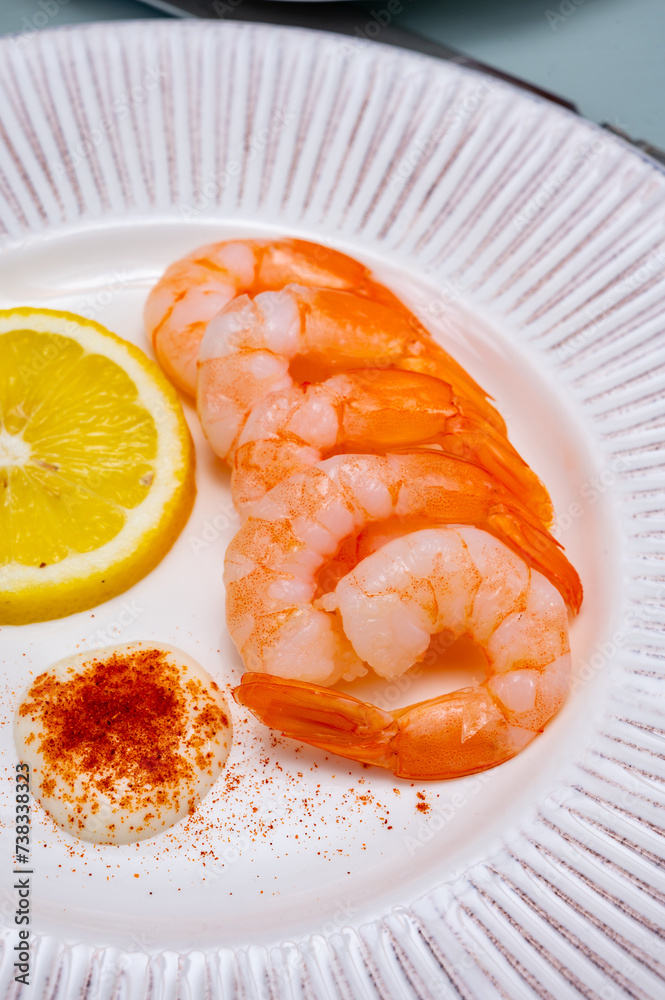 Catch of the day, fresh cooked shrimps served with lemon and garlic sauce in seafood restaurant Catch of the day, fresh cooked shrimps served with lemon and garlic sauce in seafood restaurant