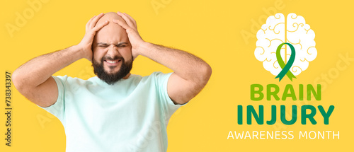 Stressed bald man on yellow background photo