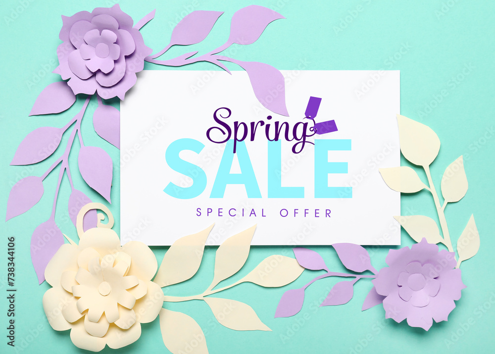 Card with text SPRING SALE SPECIAL OFFER, paper flowers and leaves on turquoise background Card with text SPRING SALE SPECIAL OFFER, paper flowers and leaves on turquoise background