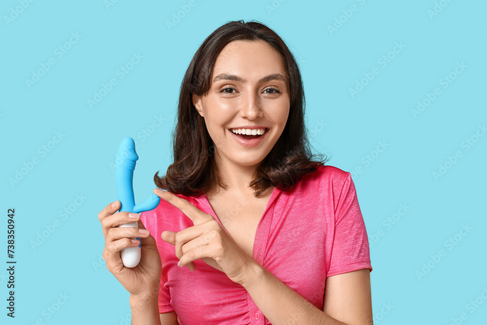 Beautiful young woman with vibrator on blue background Beautiful young woman with vibrator on blue background