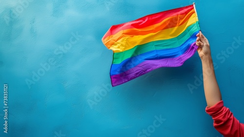 holding the flag of the lgbt community