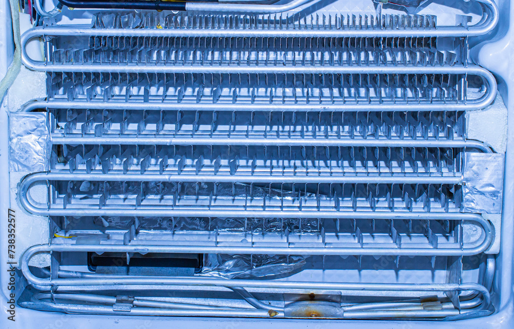 close-up of the insides of a home refrigerator during cleaning and repair service at an official diagnostic center close-up of the insides of a home refrigerator during cleaning and repair service at an official diagnostic center
