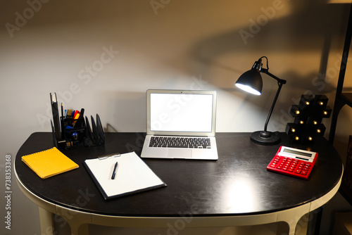 Blank laptop with stationer...