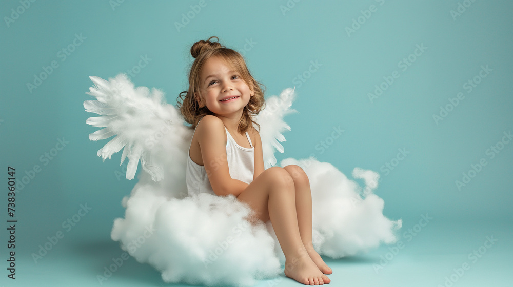 Baby Angel Wings, Angelic Cupid Kid, adorable girl Child sitting and posing at Blue Sky Cloud, with copy space. Baby Angel Wings, Angelic Cupid Kid, adorable girl Child sitting and posing at Blue Sky Cloud, with copy space.