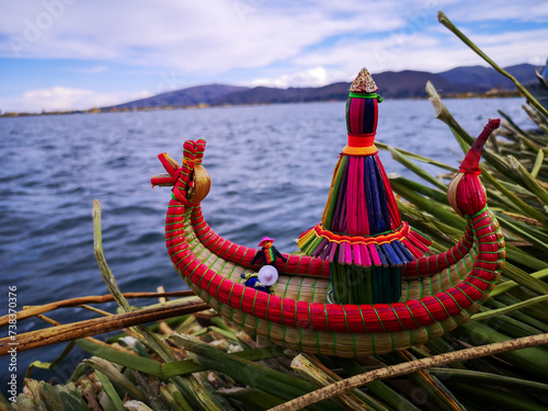 Small reed raft in floating islands of the Uros photo