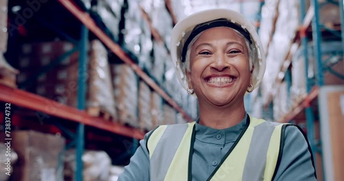 Senior woman, helmet and warehouse for logistics, shipping business and boss, pride and smile in portrait. Supply chain, distribution industry and manager at storage facility with hardhat for safety photo
