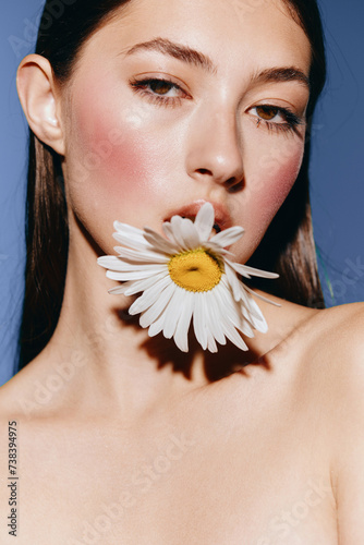 Floral Beauty: A Young Caucasian Woman with Perfect Makeup and Fresh Skin Lying on a Floral Background