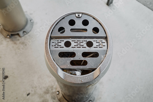 Nagano, Japan - 4 November 2023 : View of an ashtray inside a designated smoking booth for smokers at Nagano, Japan.
